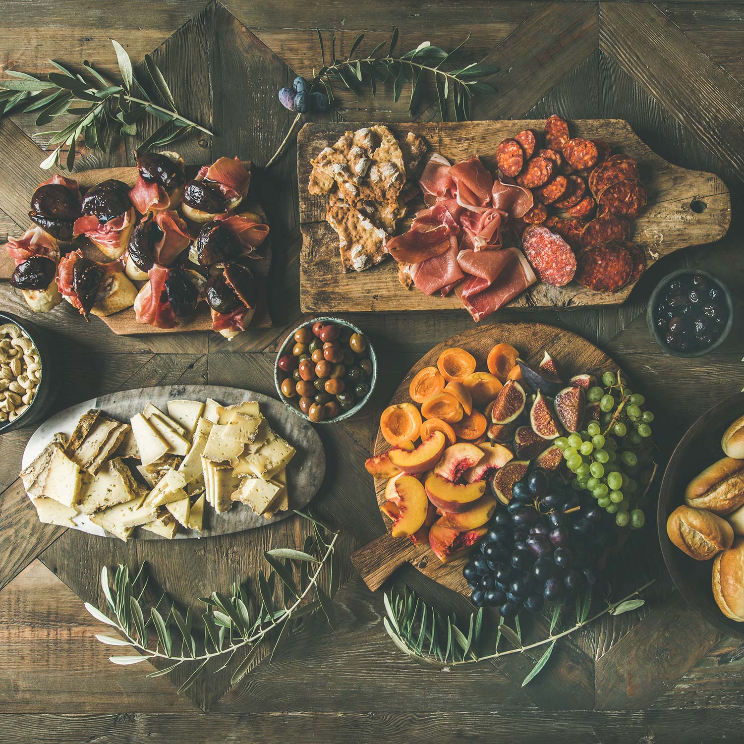 Catering table with assorted cheeses, meats and fruits